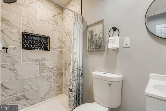 a bathroom with a toilet and a sink