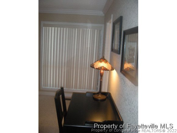 2965 Middlesex Road Fayetteville, NC 28306 - Photo 11 of 25 a table and chair in a room