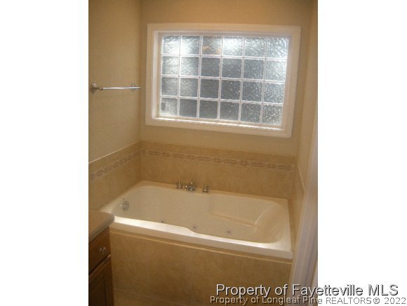 2965 Middlesex Road Fayetteville, NC 28306 - Photo 9 of 25 a bath tub sitting next to a window