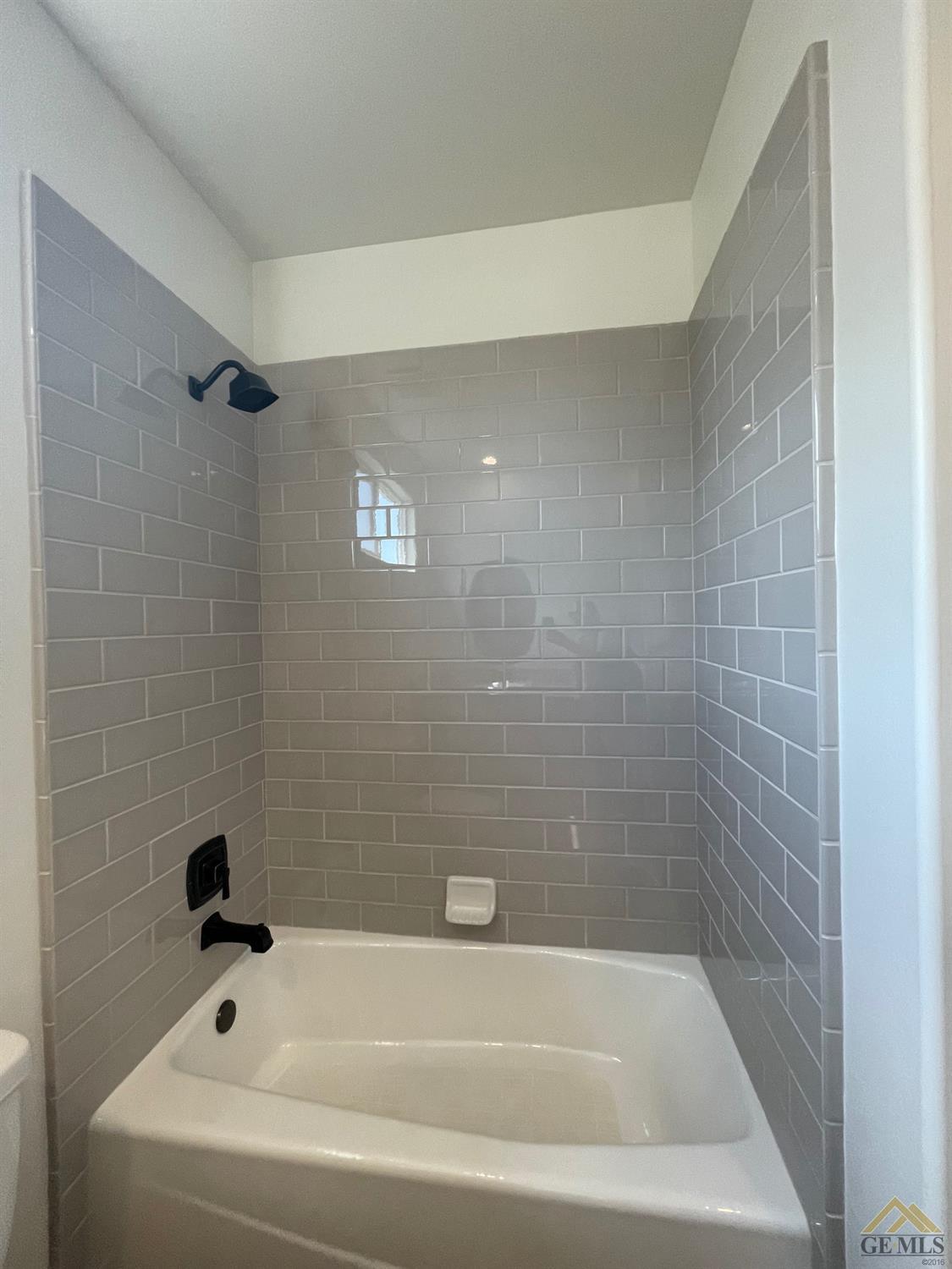 Undisclosed Address Bakersfield, CA 93314 - Photo 11 of 19 Hall bath tub/shower.