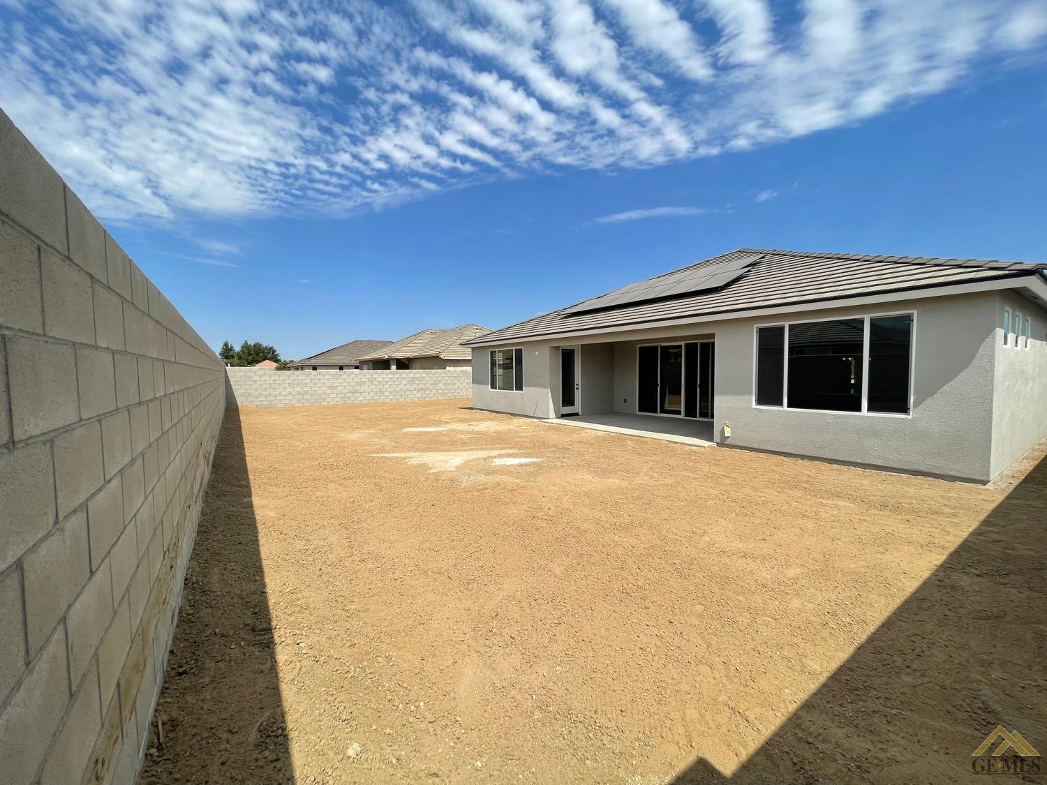 Undisclosed Address Bakersfield, CA 93314 - Photo 15 of 19 Spacious backyard on a 10640 SF home site.
