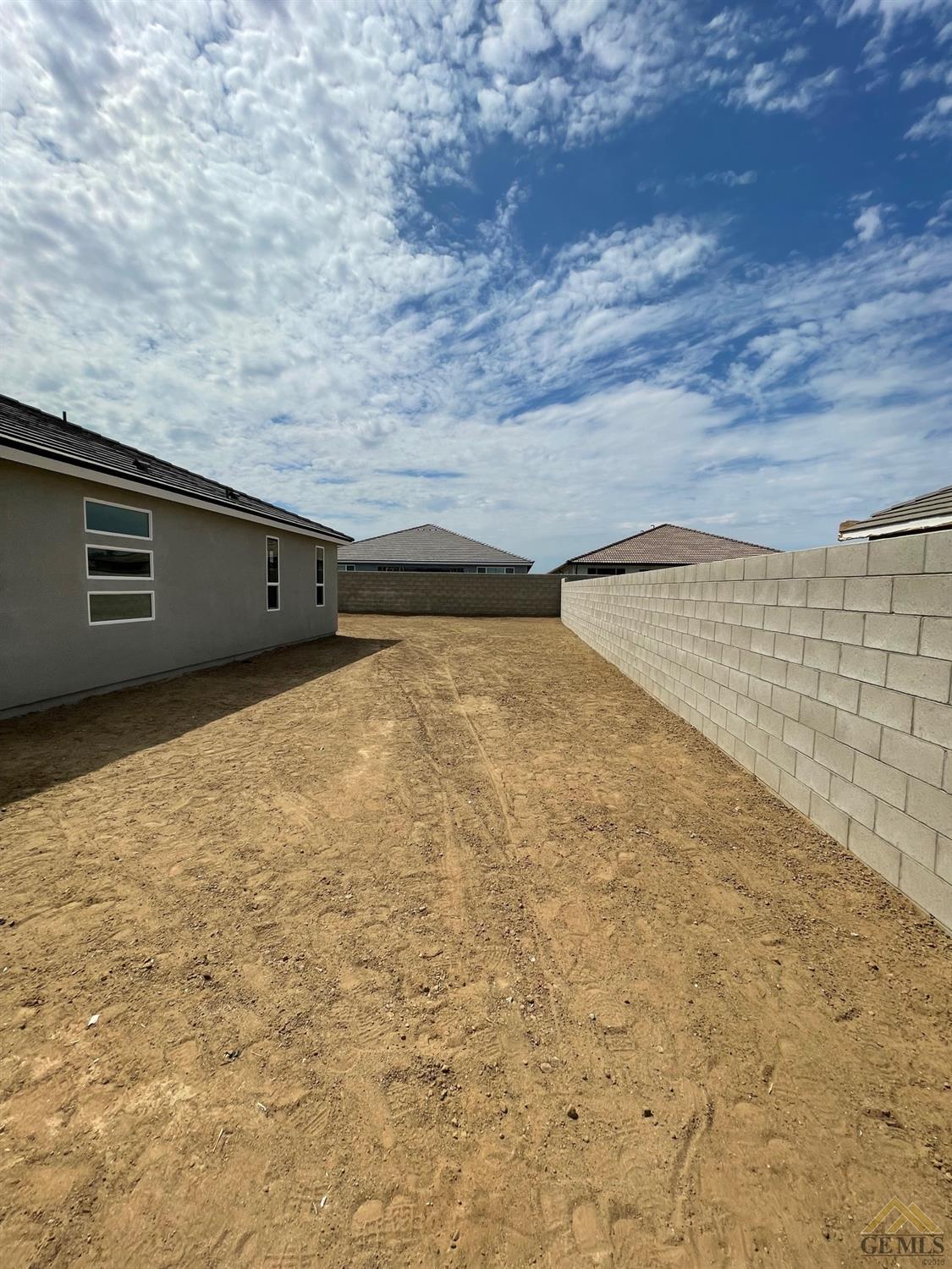 Undisclosed Address Bakersfield, CA 93314 - Photo 16 of 19 Spacious side yard on garage side of home.