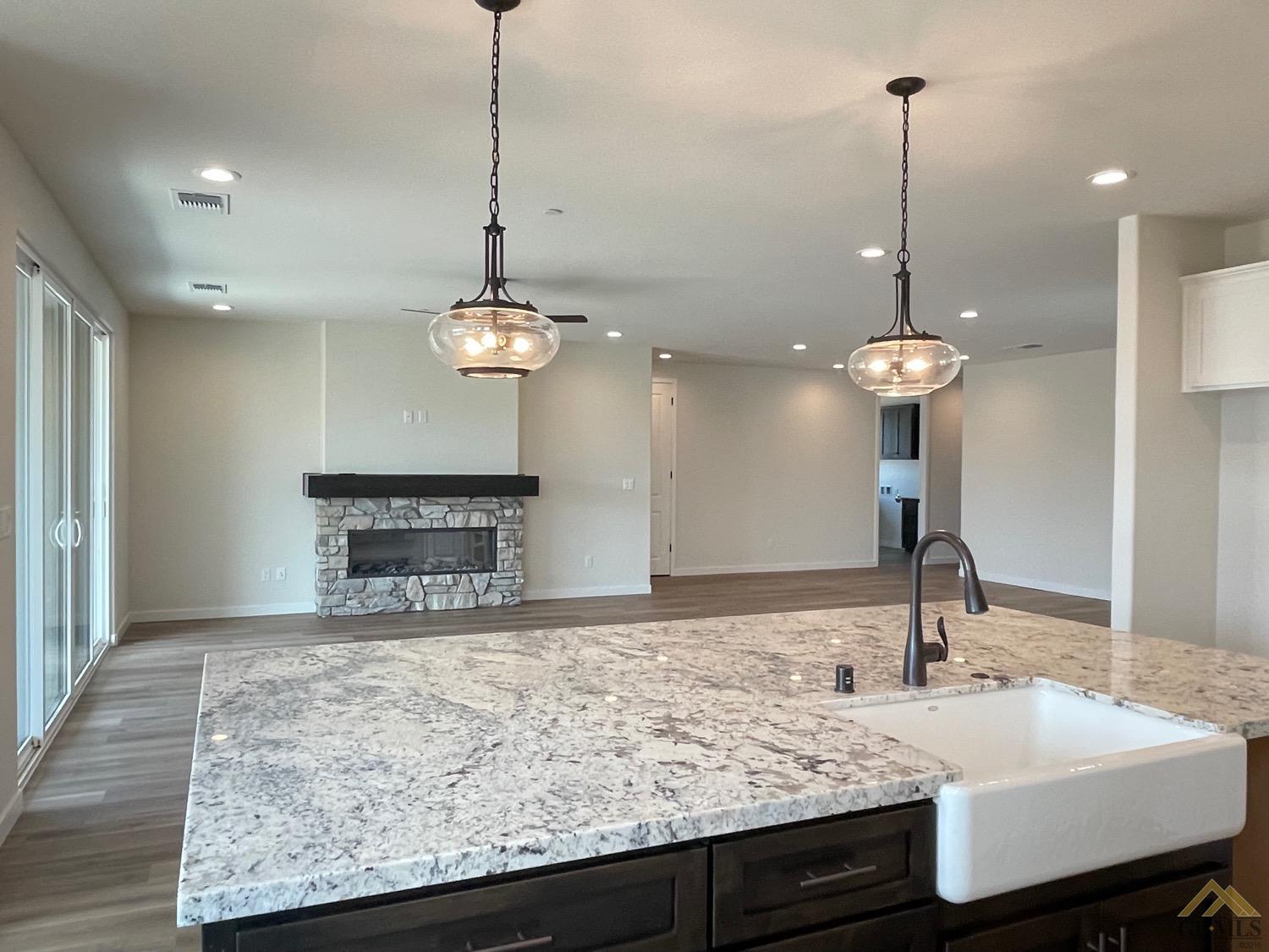 Undisclosed Address Bakersfield, CA 93314 - Photo 4 of 19 Lovely fireplace with open concept living.