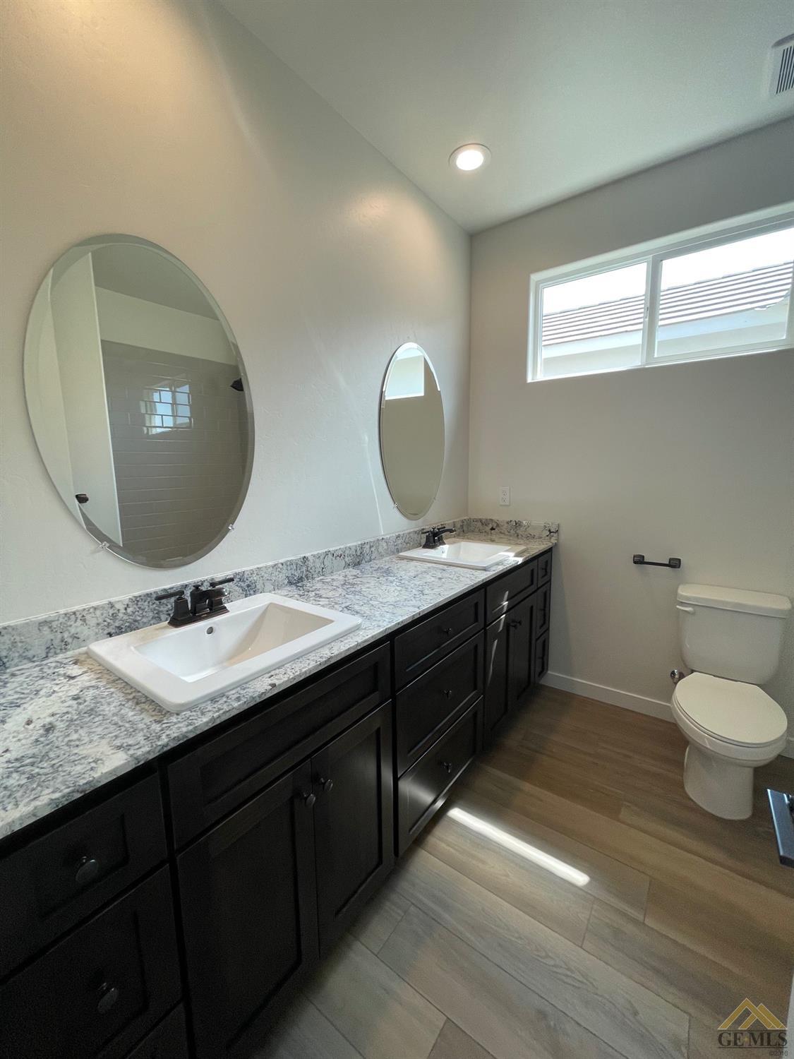 Undisclosed Address Bakersfield, CA 93314 - Photo 10 of 19 Hall bath with dual vanities.
