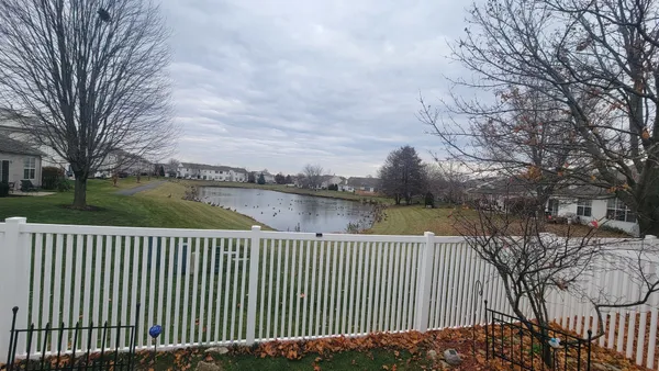 a view of a backyard with furniture