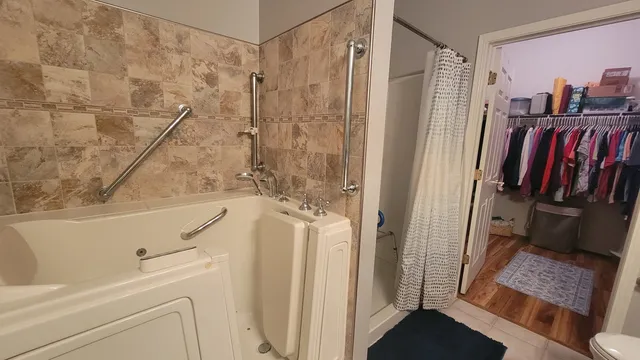 a view of balcony with yard and lake view