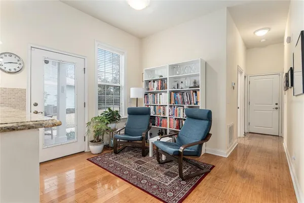 a living room with furniture and a rug