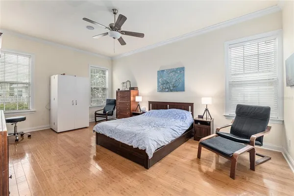 a bedroom with a bed and a chair