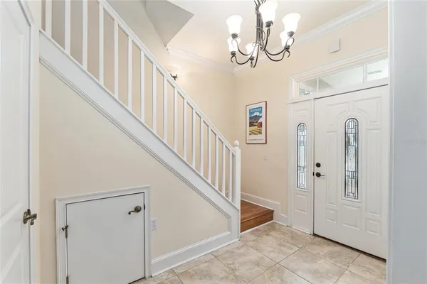 a view of an entryway with wooden floor