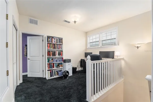 a view of livingroom with furniture and windows