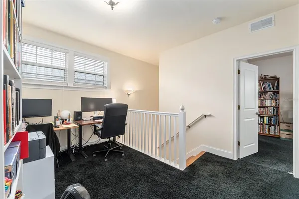 a workspace with furniture and a window