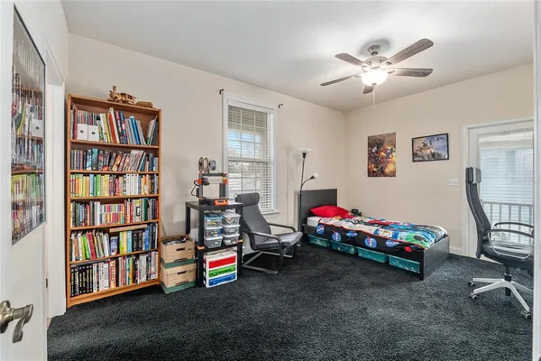 a living room with lots of furniture and baby room