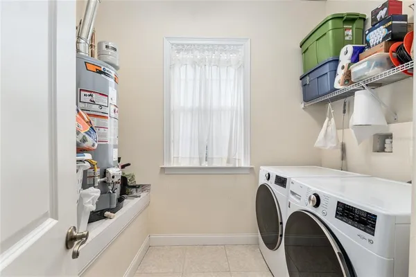 a view of storage and utility room with washer and dryer