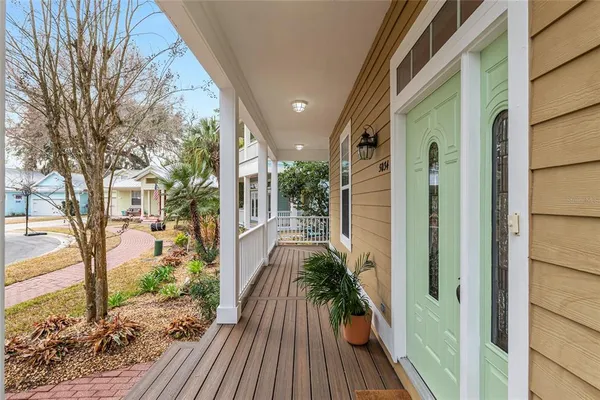 a view of balcony with wooden floor and fence