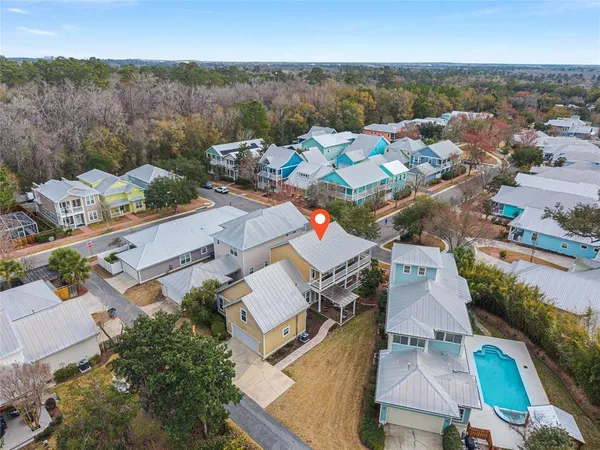 an aerial view of residential houses with outdoor space