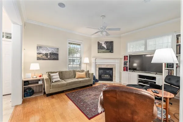 a living room with furniture and a fireplace