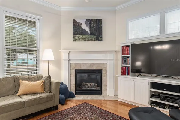 a living room with furniture and a fireplace