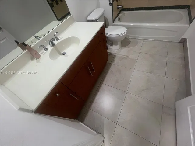 a view of a bathroom with a sink and toilet