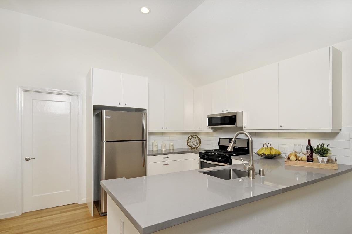 635 California Street Mountain View, CA 94041 - Photo 8 of 25 a kitchen with a refrigerator and a stove top oven