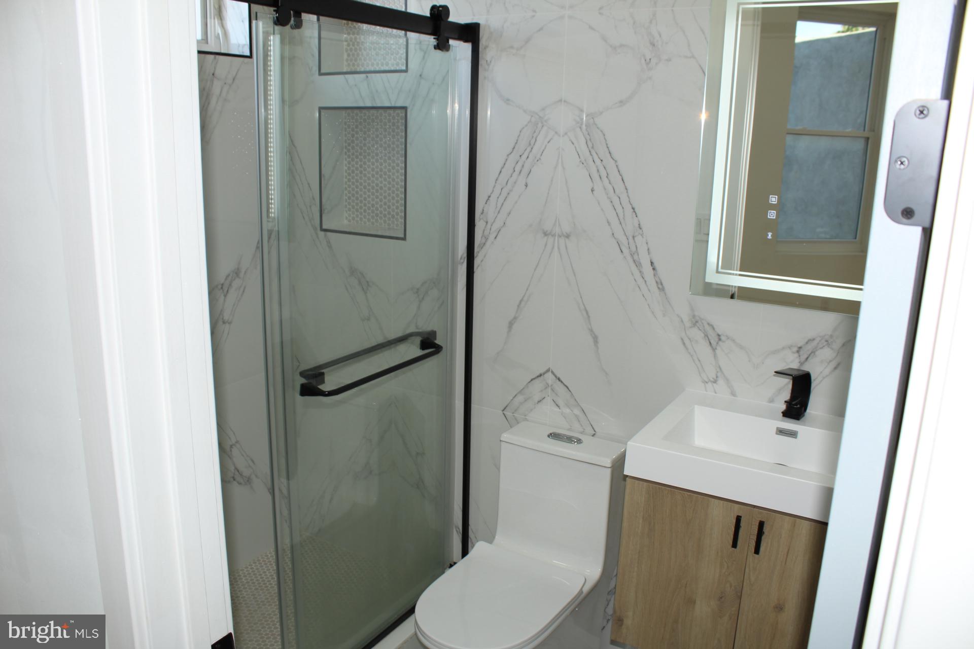 3017 Ridge Avenue, Unit C Philadelphia, PA 19121 - Photo 22 of 27 Sleek modern bathroom with elegant finishes.