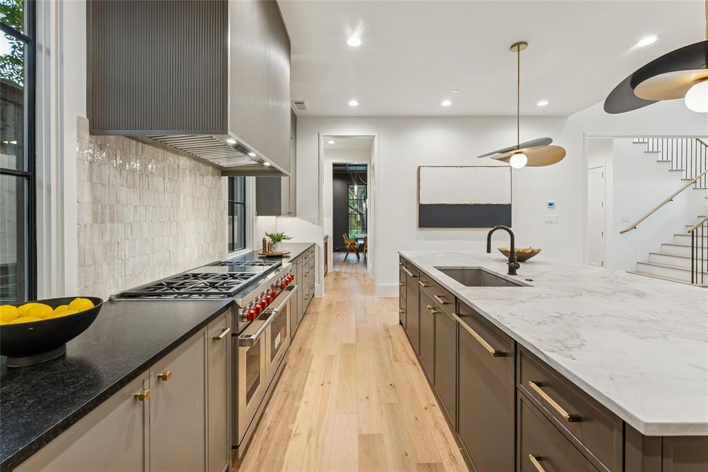 4901 Hanover Avenue Dallas, TX 75209 - Photo 13 of 30 a kitchen with a stove and a sink