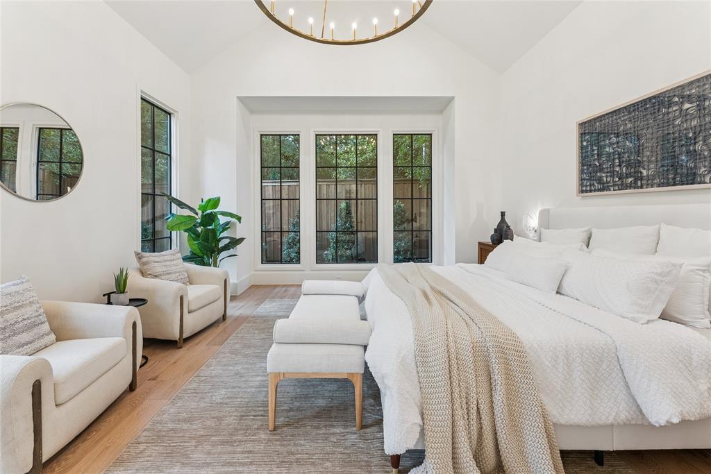 4901 Hanover Avenue Dallas, TX 75209 - Photo 17 of 30 a bedroom with a large bed and a couch