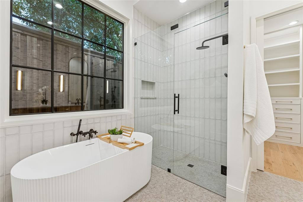 4901 Hanover Avenue Dallas, TX 75209 - Photo 19 of 30 a bathroom with a bathtub and shower