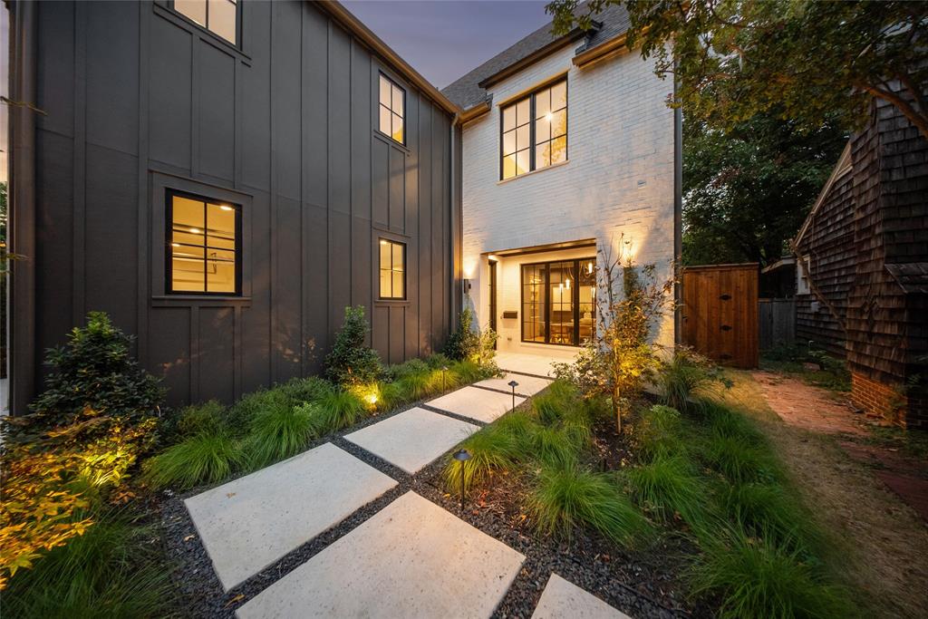4901 Hanover Avenue Dallas, TX 75209 - Photo 4 of 30 a view of a brick house with a yard plants and large tree