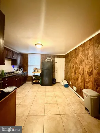 a large bedroom with a bed and furniture