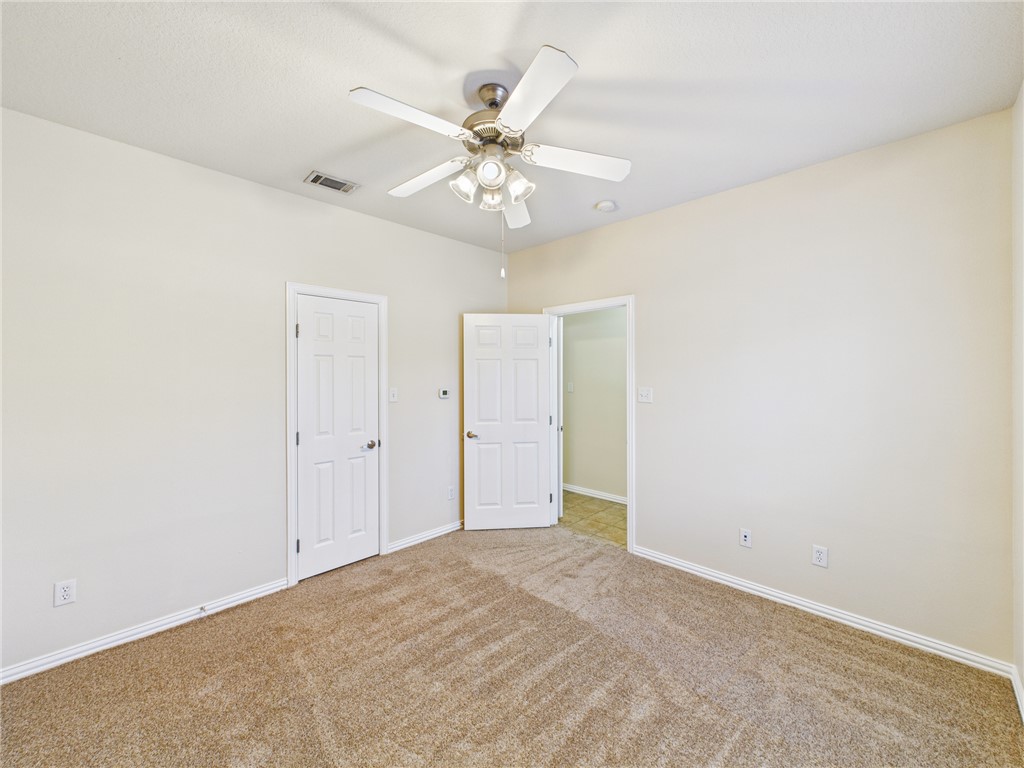 1001 Krenek Tap Road, Unit 603 College Station, TX 77840 - Photo 14 of 31 an empty room with a ceiling fan and a window