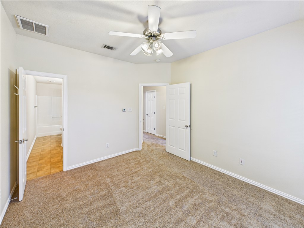 1001 Krenek Tap Road, Unit 603 College Station, TX 77840 - Photo 29 of 31 an empty room with closet and a chandelier fan