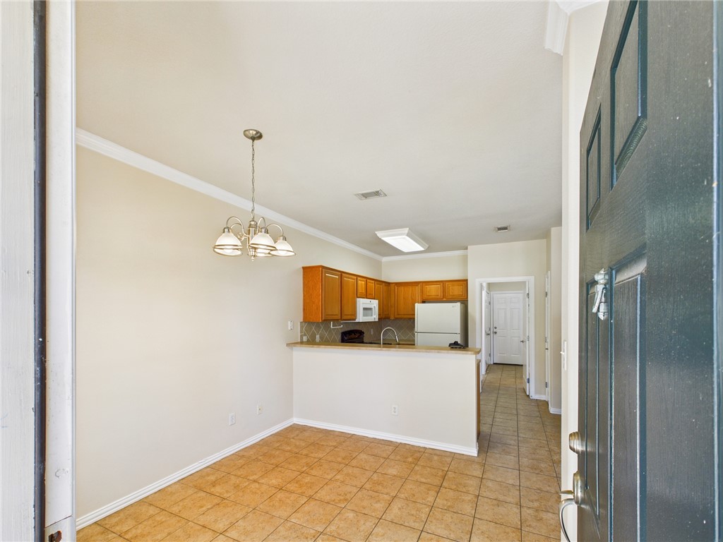 1001 Krenek Tap Road, Unit 603 College Station, TX 77840 - Photo 4 of 31 a view of a kitchen from the hallway