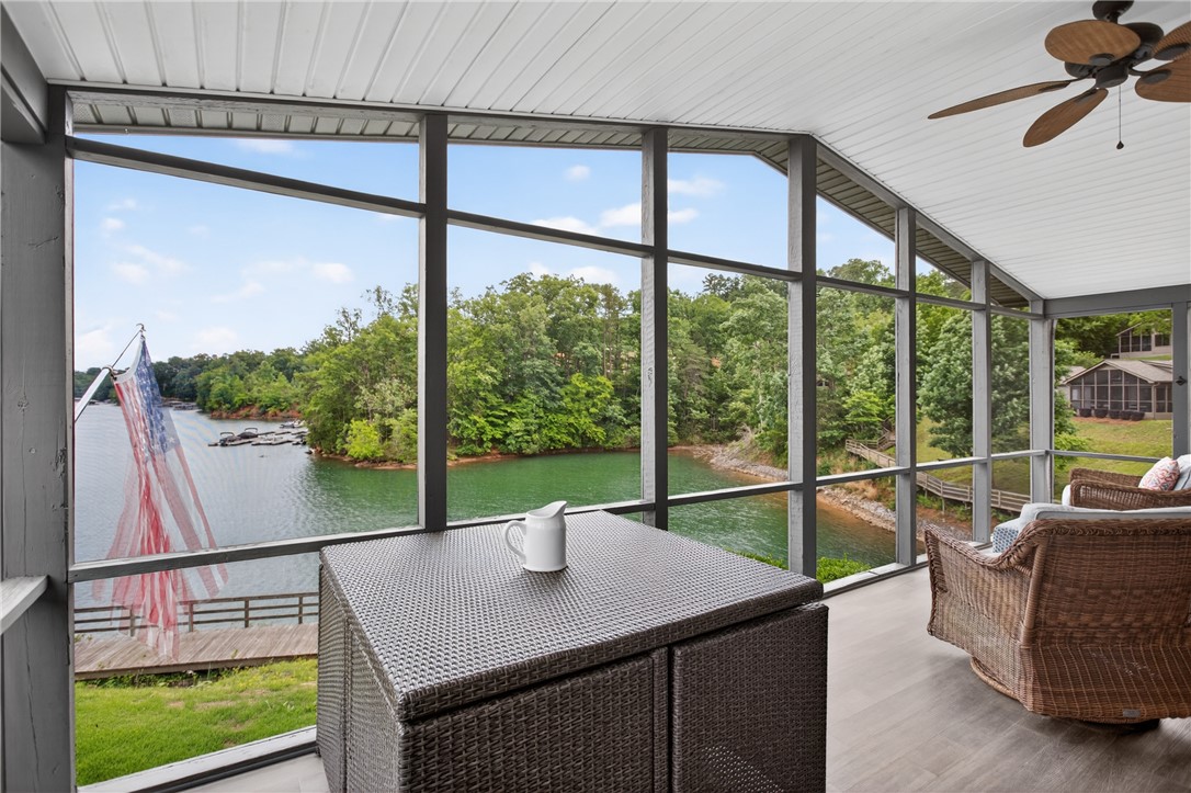 1230 Melton Road, Unit 4 West Union, SC 29696 - Photo 30 of 48 Enjoy tranquil water views from this inviting screened porch, perfect for relaxation.