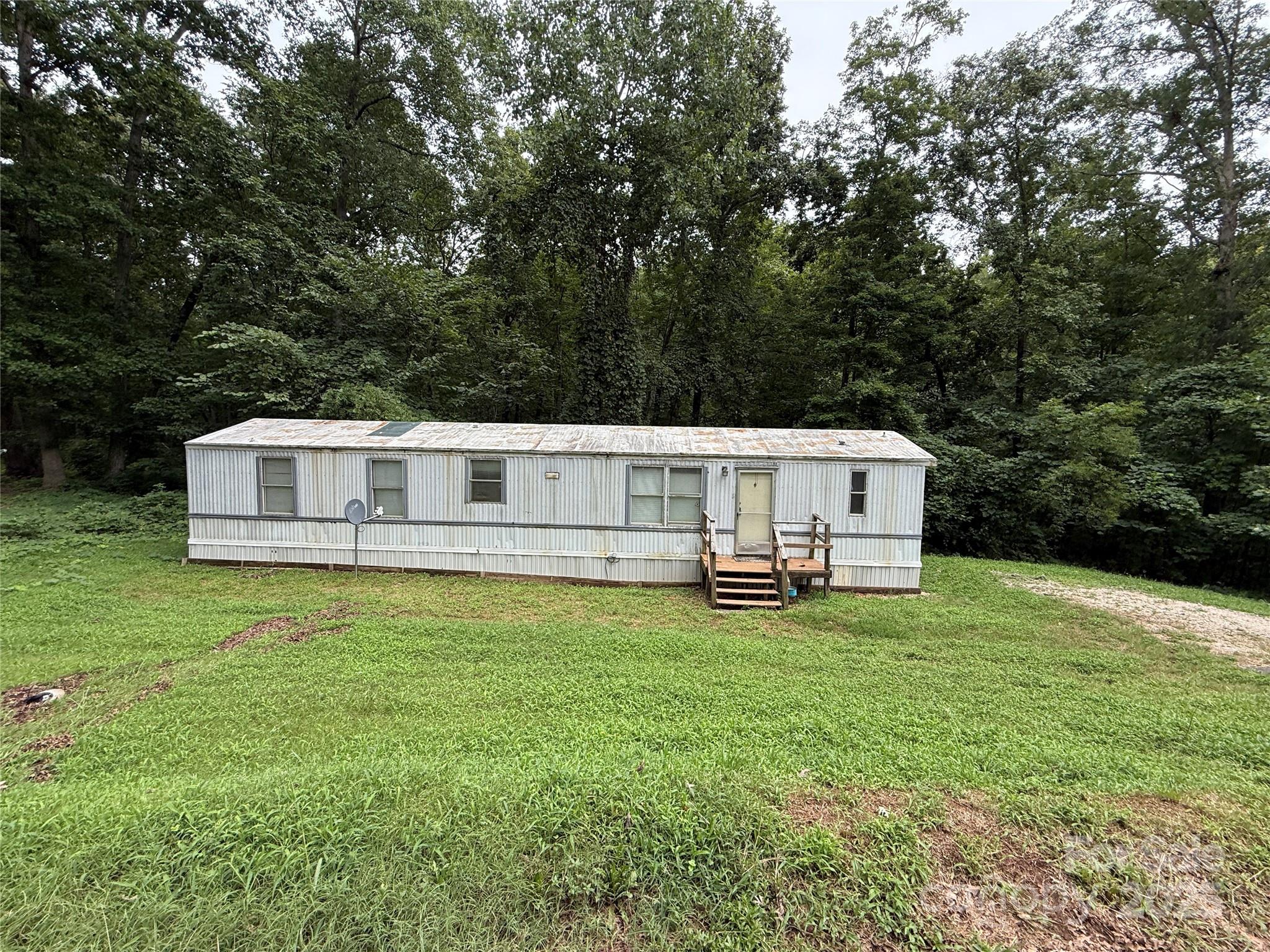 a house view with a sitting space and garden