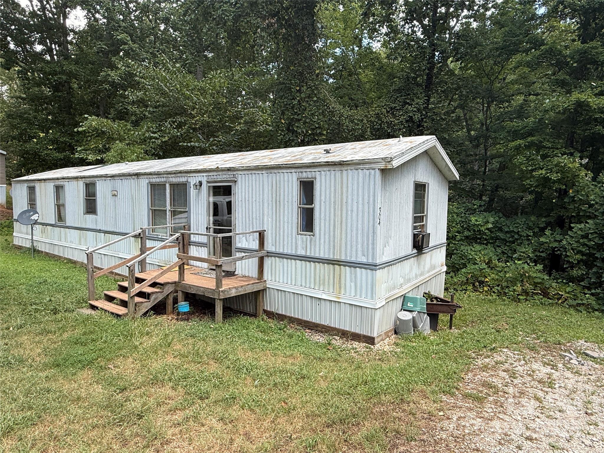 247 Star Road York, SC 29745 - Photo 2 of 9 a view of a backyard with sitting area and garden