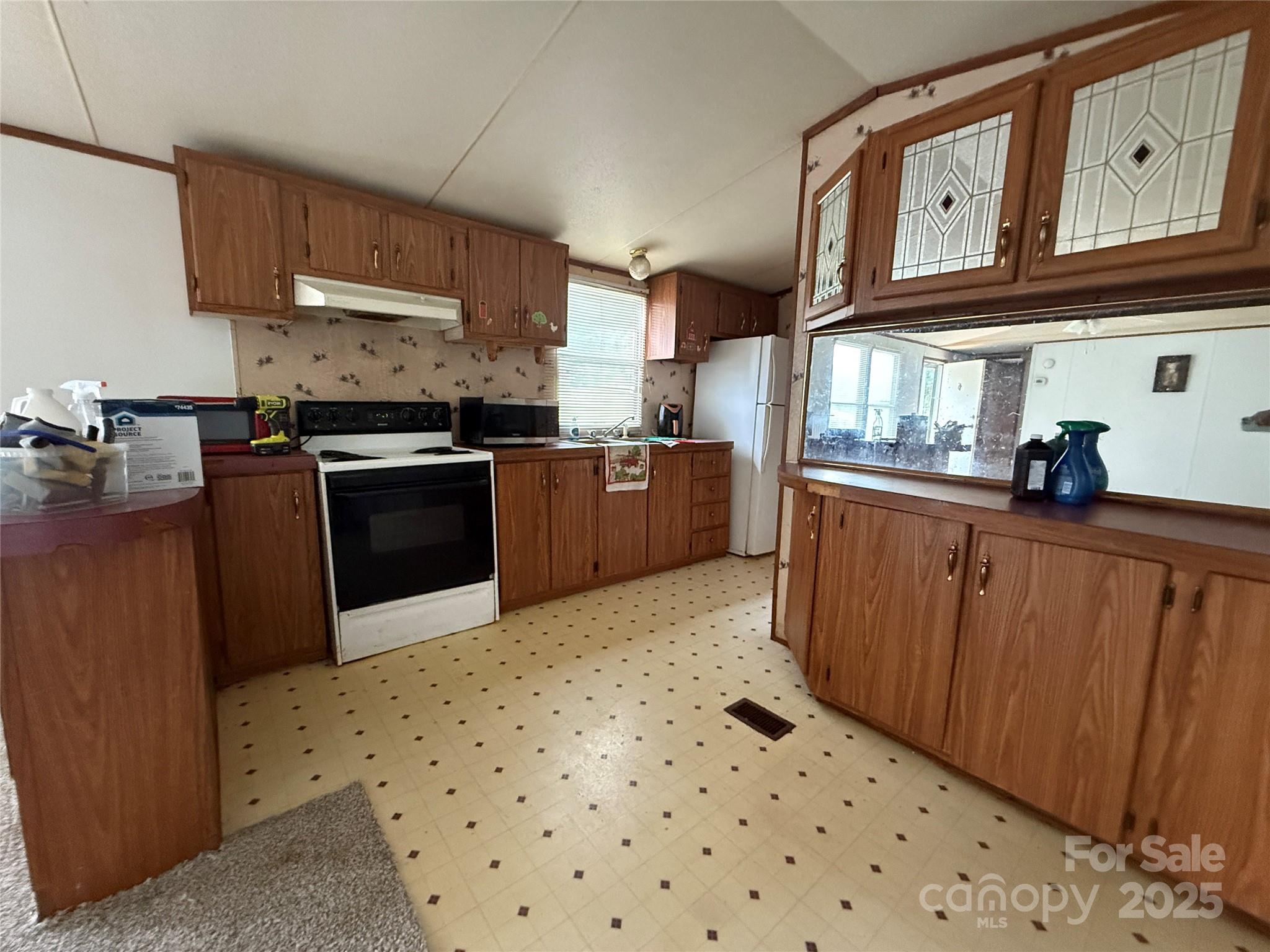 247 Star Road York, SC 29745 - Photo 6 of 9 a kitchen with stainless steel appliances granite countertop a sink stove and refrigerator