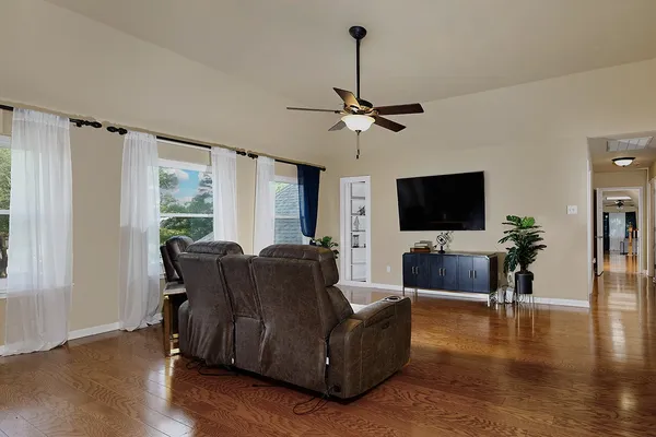 a living room with furniture and a flat screen tv