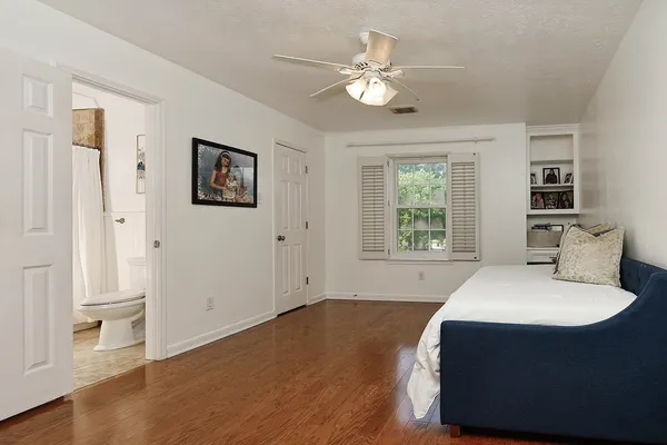 a view of a livingroom with furniture window and wooden floor