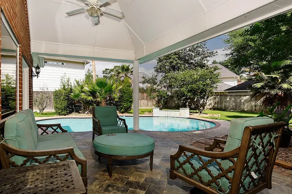 a view of a swimming pool with chairs