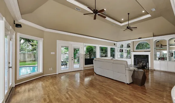 a living room with furniture and a fireplace