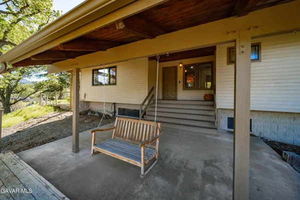 a view of a porch with a bench