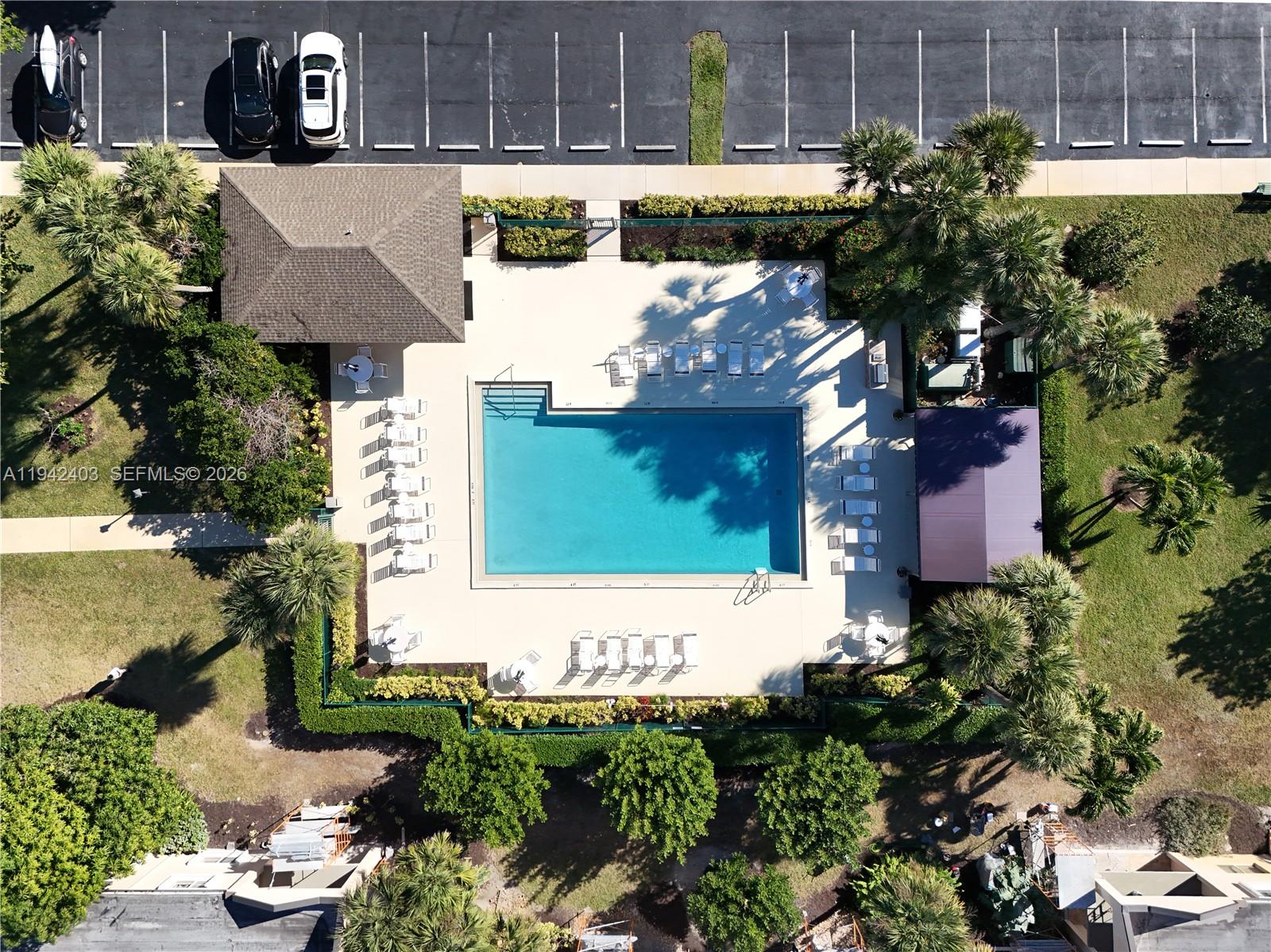 275 Palm Avenue, Unit A407 Jupiter, FL 33477 - Photo 26 of 29 a view of a house with a plants and a tree