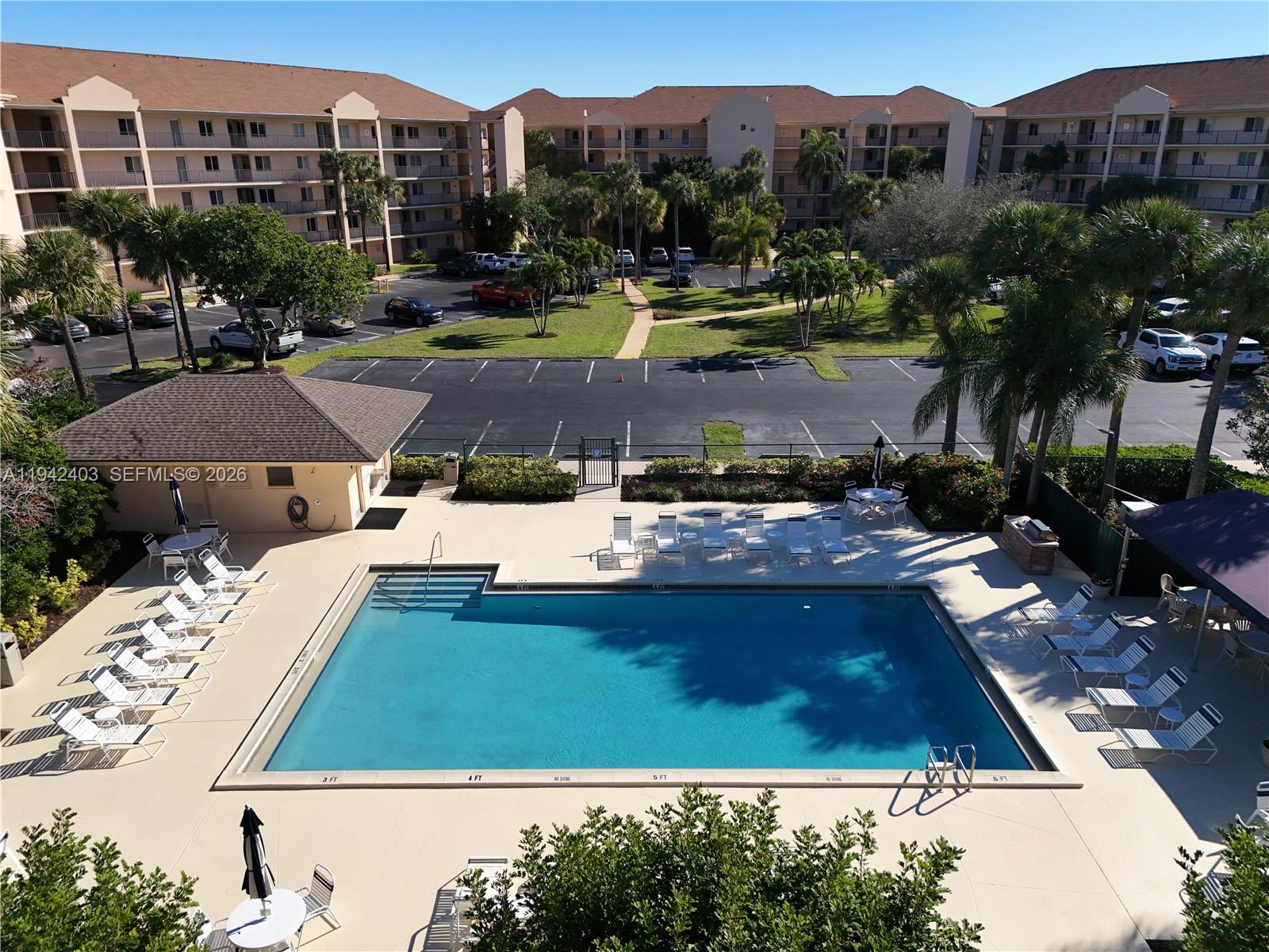 275 Palm Avenue, Unit A407 Jupiter, FL 33477 - Photo 27 of 29 a view of a city with lawn chairs