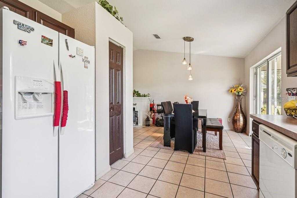 133 Walnut Road Ocala, FL 34480 - Photo 12 of 31 a view of kitchen with furniture and refrigerator
