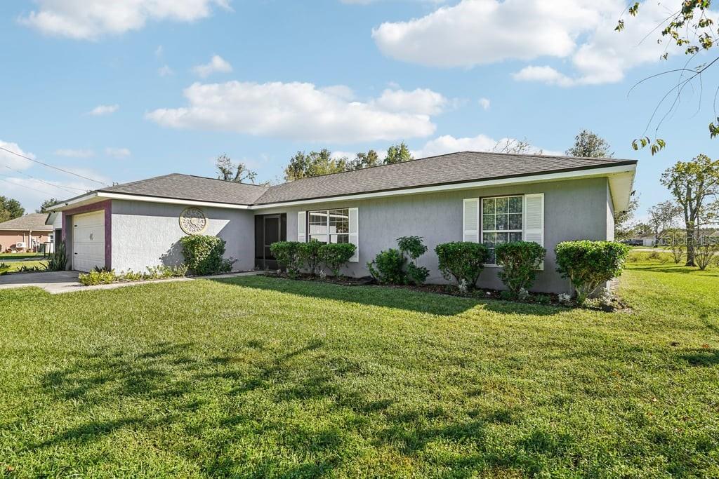 133 Walnut Road Ocala, FL 34480 - Photo 2 of 31 a view of a house with backyard and garden