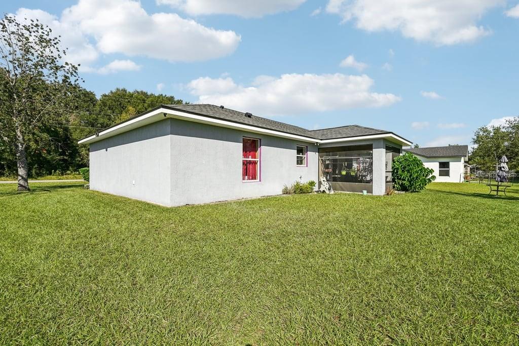 133 Walnut Road Ocala, FL 34480 - Photo 28 of 31 a front view of house with yard and trees