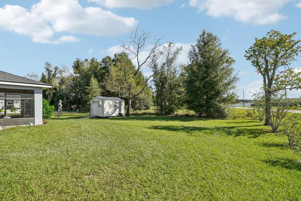 133 Walnut Road Ocala, FL 34480 - Photo 30 of 31 a front view of a house with garden