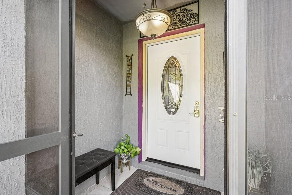 133 Walnut Road Ocala, FL 34480 - Photo 6 of 31 a glass door with a mirror