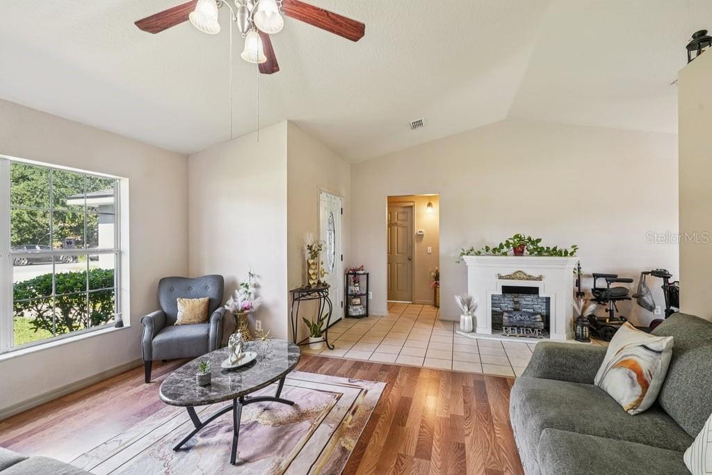 133 Walnut Road Ocala, FL 34480 - Photo 7 of 31 a living room with furniture and a fireplace