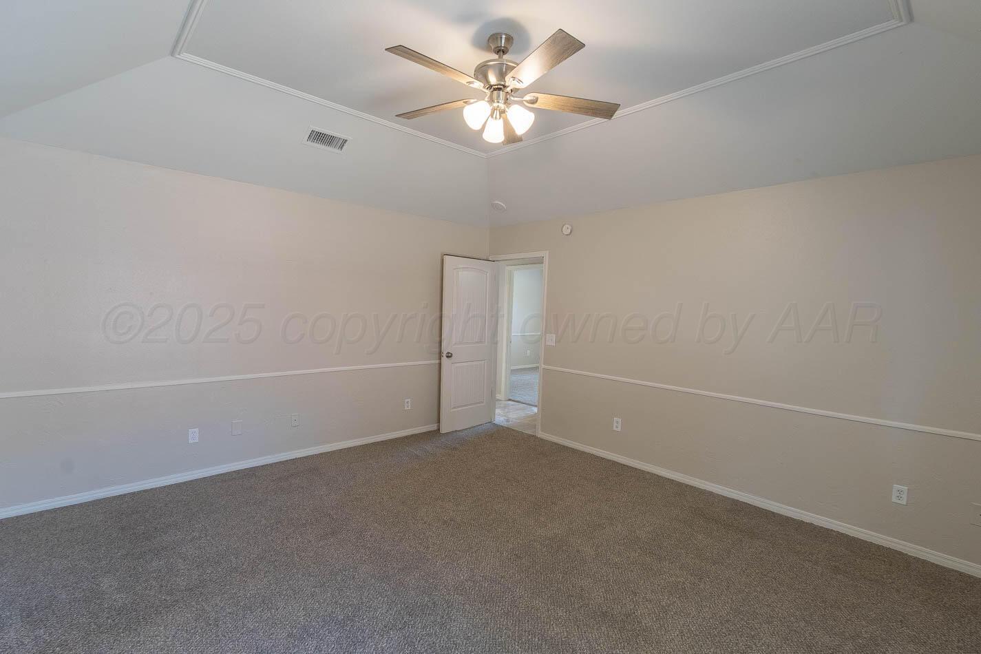 7209 Dukes Place Amarillo, TX 79109 - Photo 13 of 20 an empty room with a fan and a ceiling fan